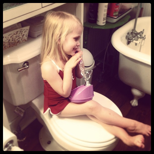 Potty? Check. Swimsuit? Check. Fancy phone? Check. All necessities to speak with Nana on the phone :).