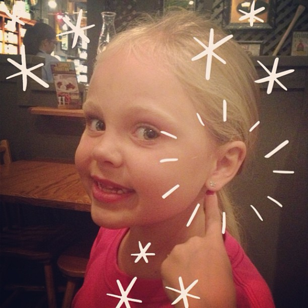 Guess who got to change earrings for the first time? And yes she requested her photo in the middle of dinner at Cracker Barrel. #dontjudge #stillundermycaloriecount #goinghometoworkout