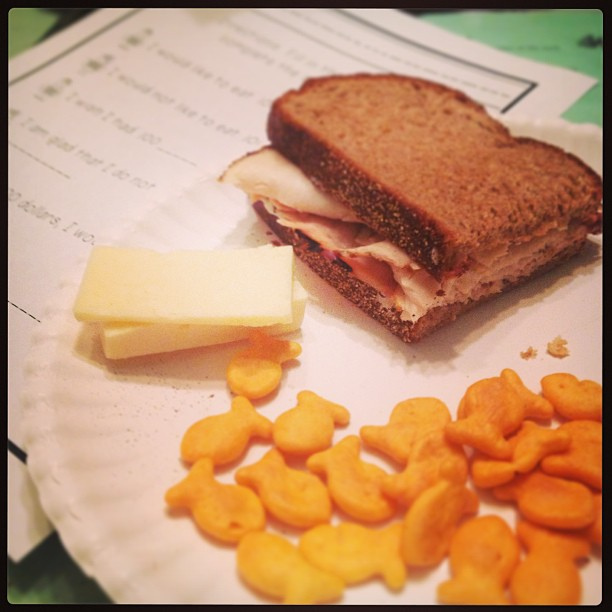 Dinner and homework. #iheartgoldfish #suchachild