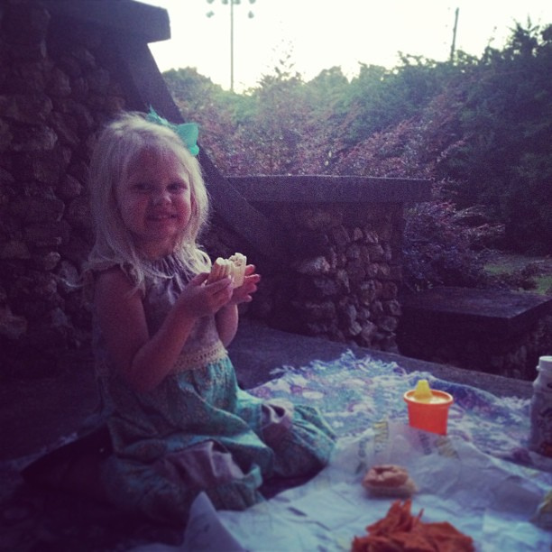 Sunset front porch picnic with Taz. Otherwise known as "trying to show the kitten that our sole purpose in life ISN'T to torture her" :).