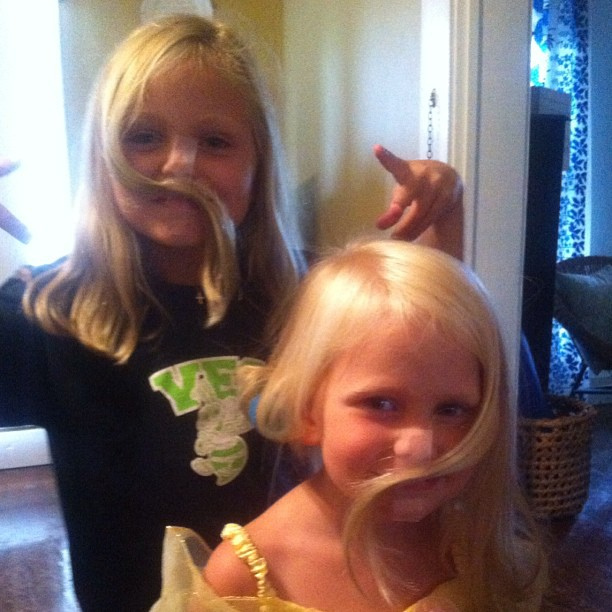 Apparently, when you stay home while daddy is working, you get a mustache courtesy of his scotch tape!